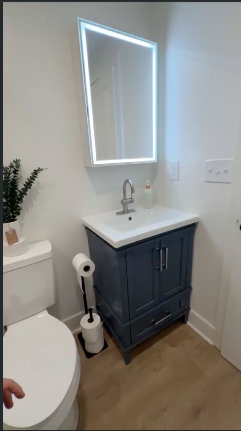 Bathroom after complete gut renovation with custom tile walls and tub
